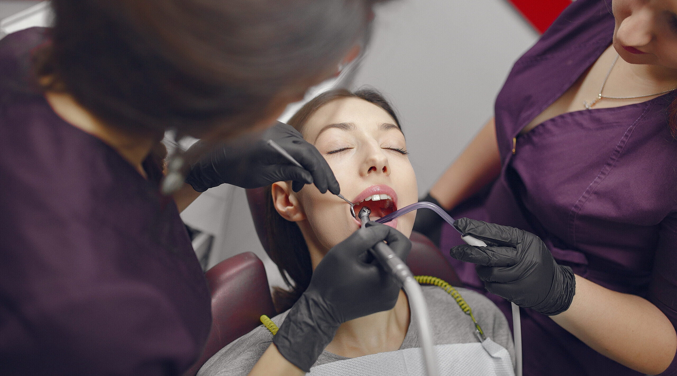 A close-up of porcelain veneers on front teeth, showcasing a natural and seamless appearance.