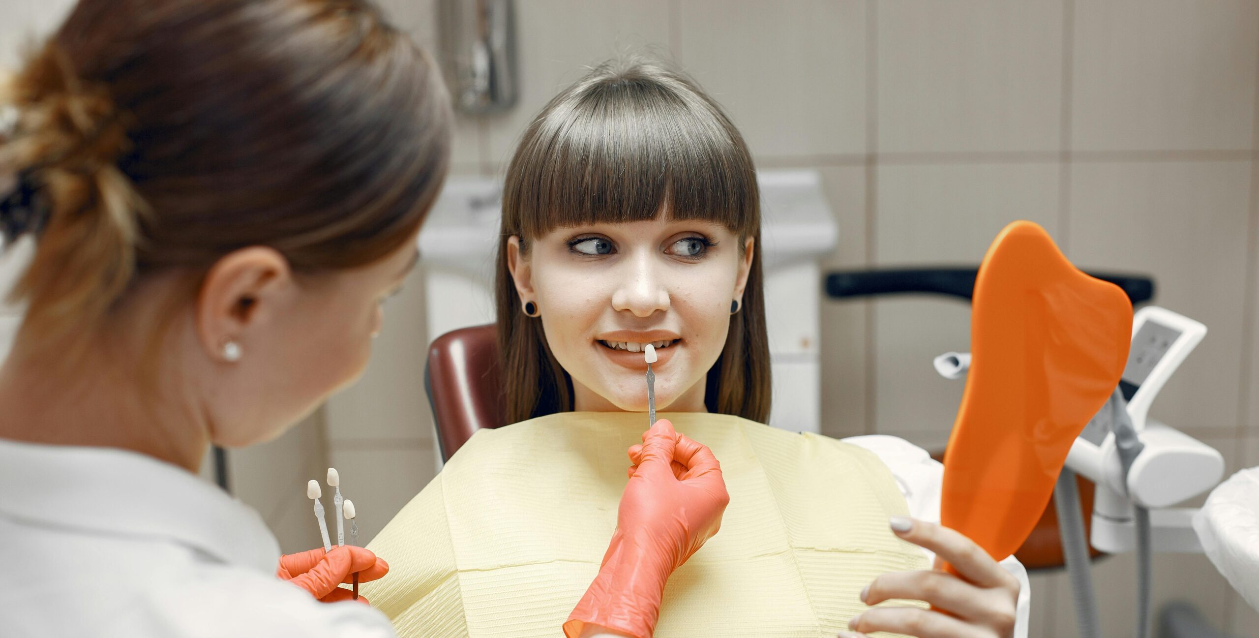 A side-by-side comparison showing teeth before and after veneers, highlighting the transformation.