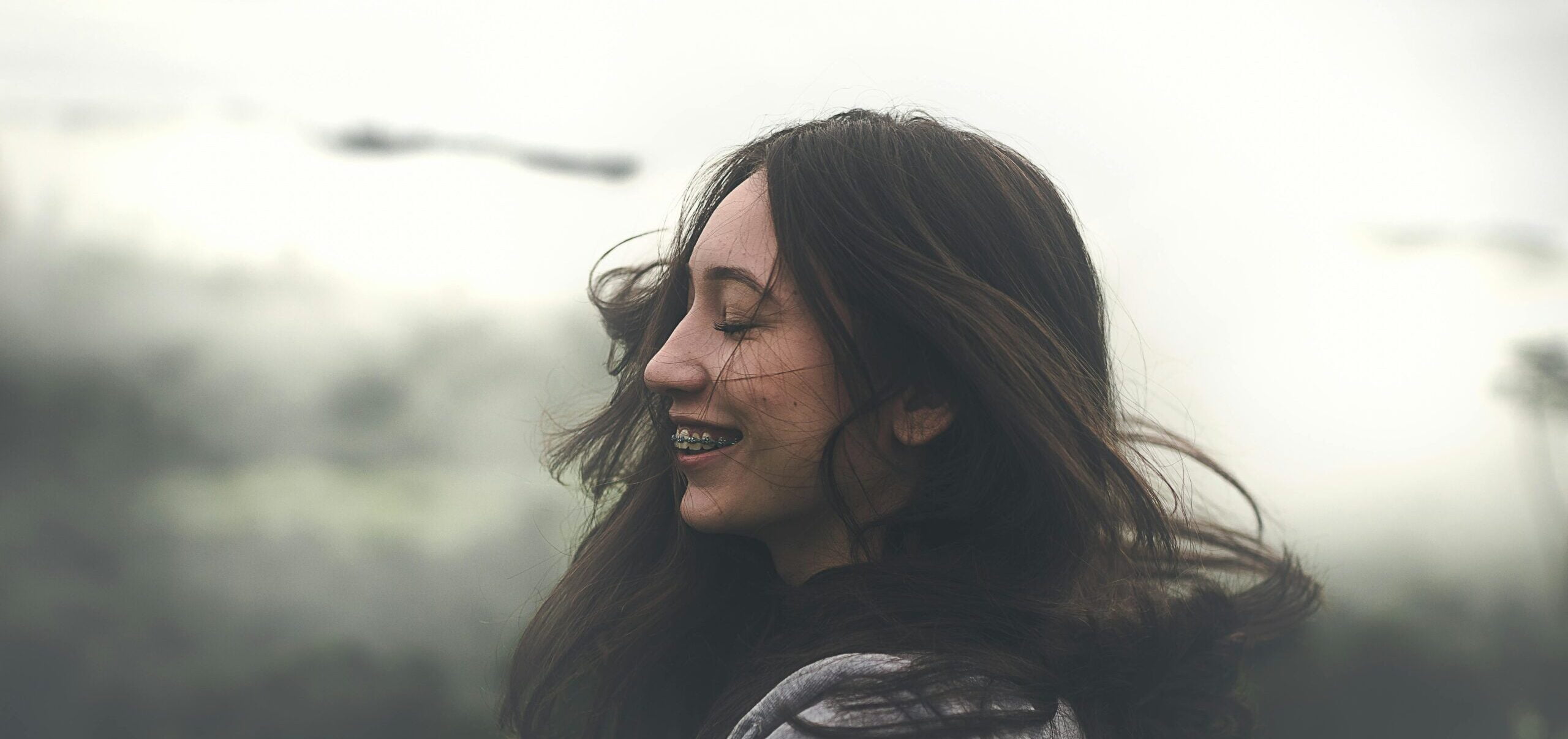 A close-up of traditional metal braces on teeth, showing their alignment function.
